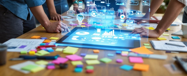 team collaborating on a digital project using a tablet with holographic interface