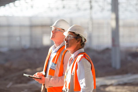 Two engineers doing onsite inspection on the construction site.