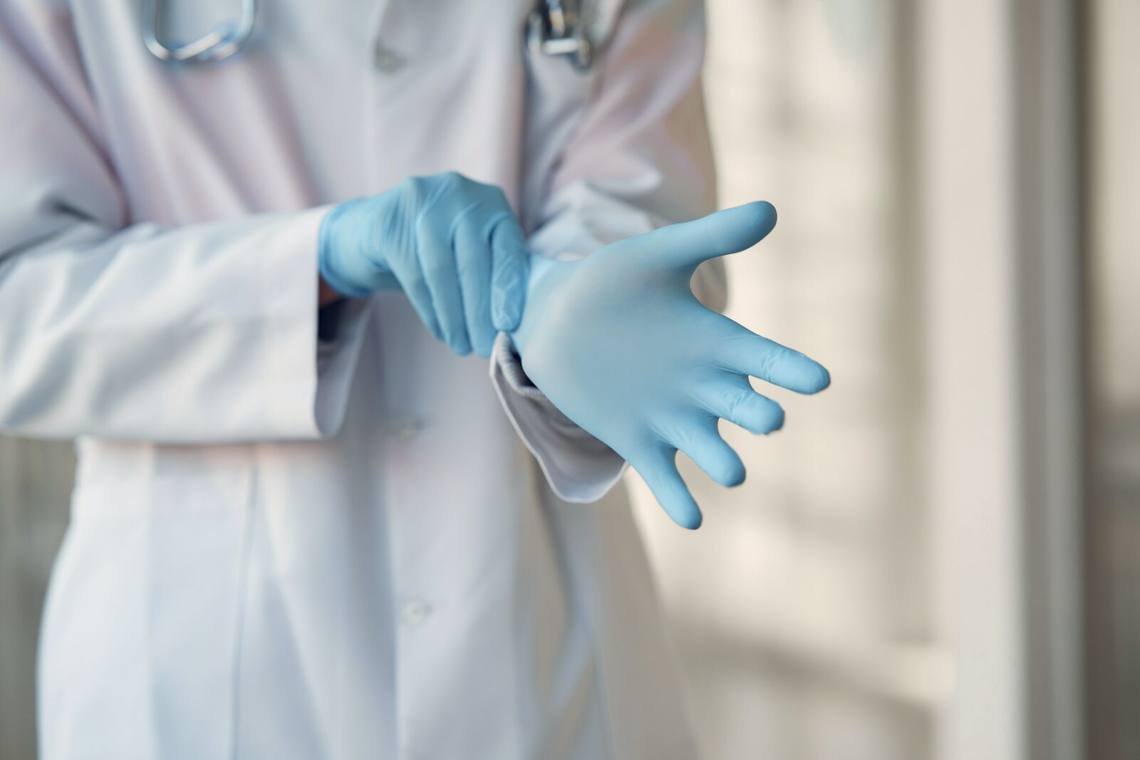 Doctor Wearing Surgical Gloves