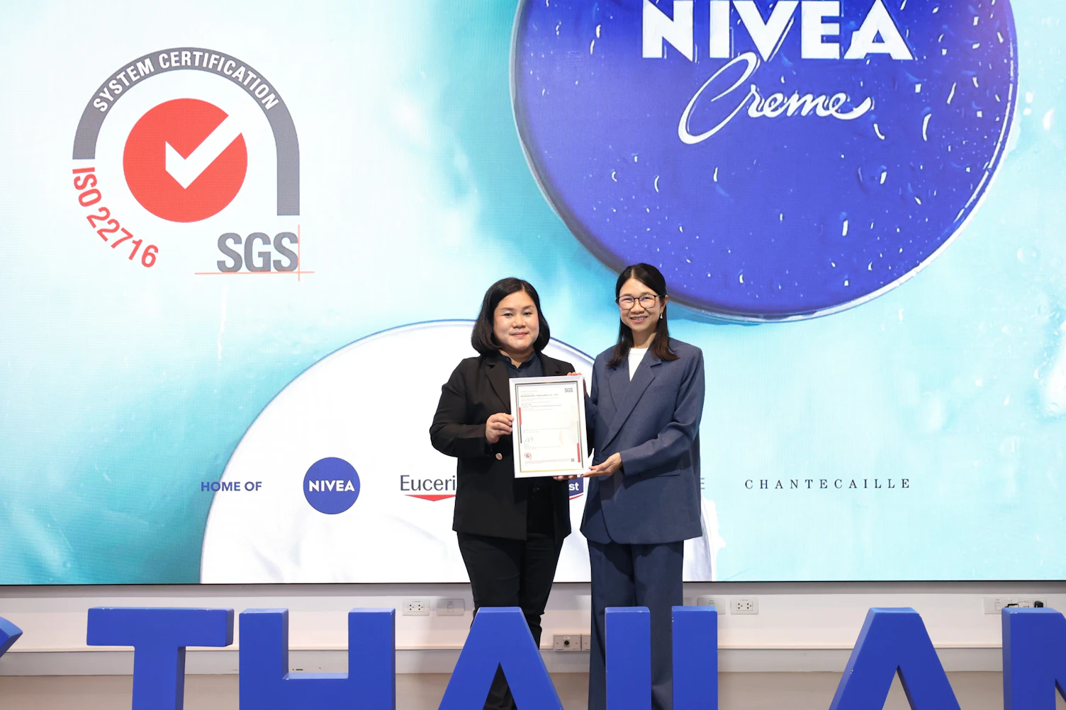 ISO 22716 certification award ceremony for Beiersdorf (Thailand) Co., Ltd., highlighting commitment to cosmetic product quality, safety, and international manufacturing standards.
