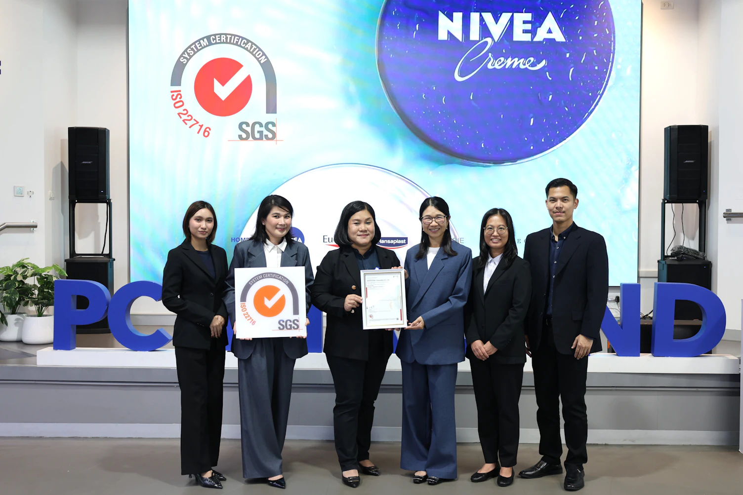 SGS presents ISO 22716 certification to Beiersdorf (Thailand) Co., Ltd. for achieving Good Manufacturing Practices (GMP) standards in cosmetic manufacturing.