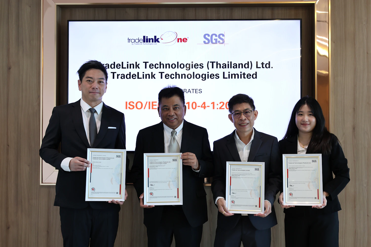 TradeLink Technologies management team celebrating ISO/IEC 29110 certification with SGS