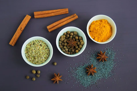 Assorted Spices Near White Ceramic Bowls