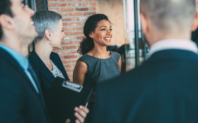 Business Professionals Smiling after Concluding a Deal