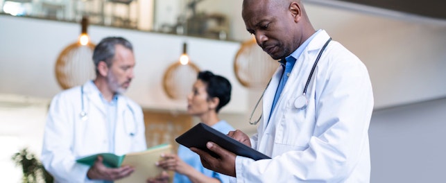 Doctor Using Digital Tablet