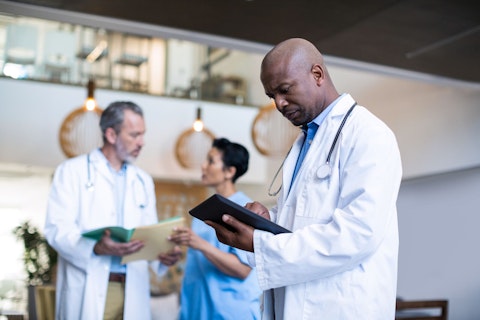 Doctor Using Digital Tablet