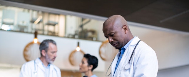 Doctor Using Digital Tablet in Hospital