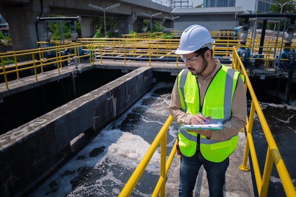 Engineer Inspecting a Sewage Treatment Plant