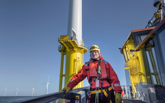 Engineer Inspecting Offshore Wind Farm