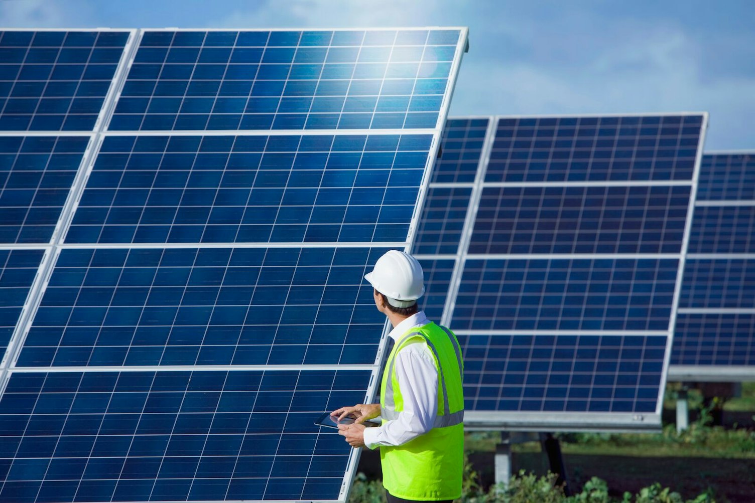 Engineer Inspecting Solar Panels
