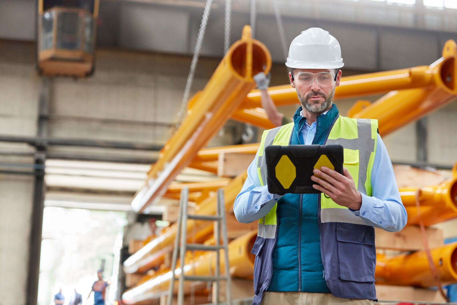 Engineer Using Digital Tablet in Factory