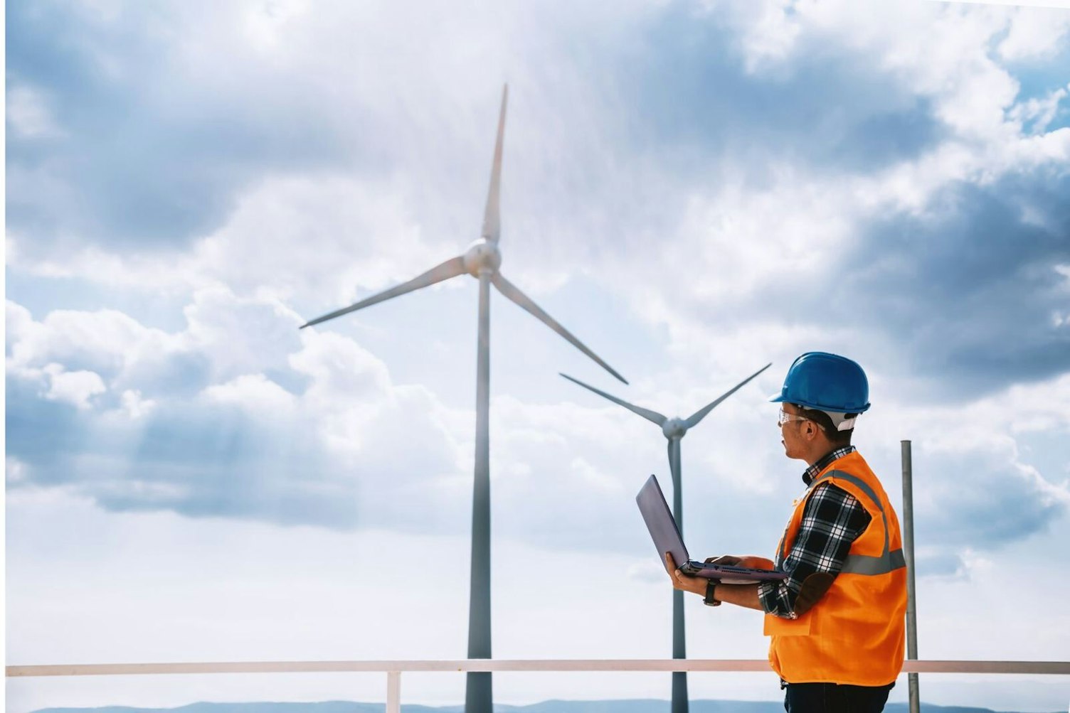 Engineer Working at Wind Turbine Farm