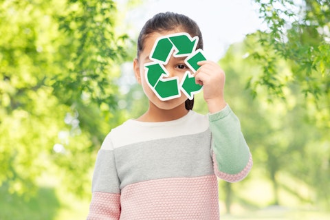 Girl Holding Green Recycling Sign