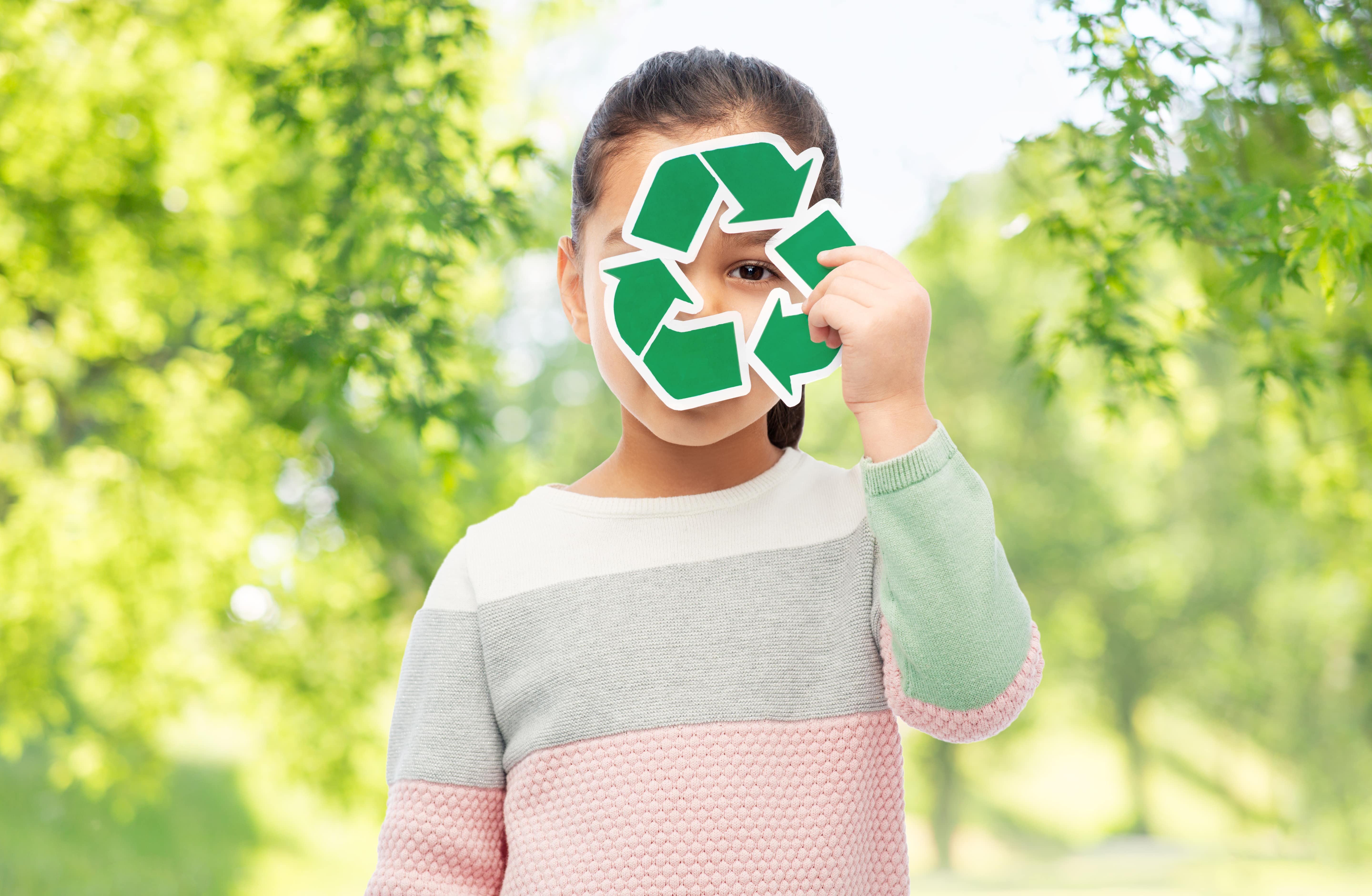 Girl Holding Green Recycling Sign
