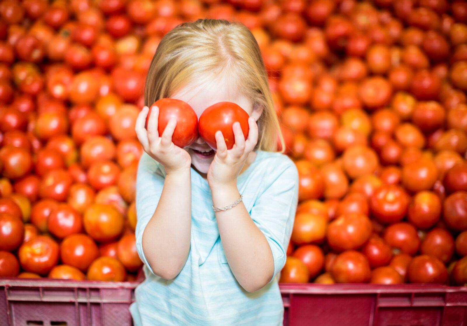 Girl Playing with Tomatoes