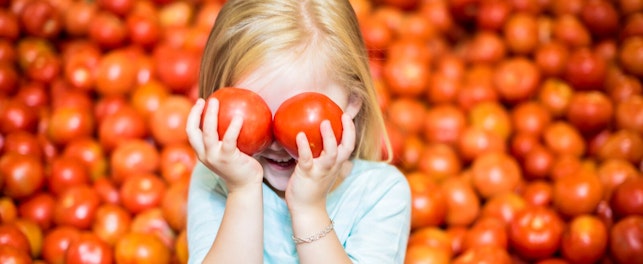 Girl Playing with Tomatoes