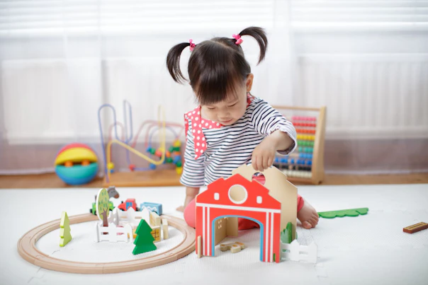 Girl Playing with Wooden Toys