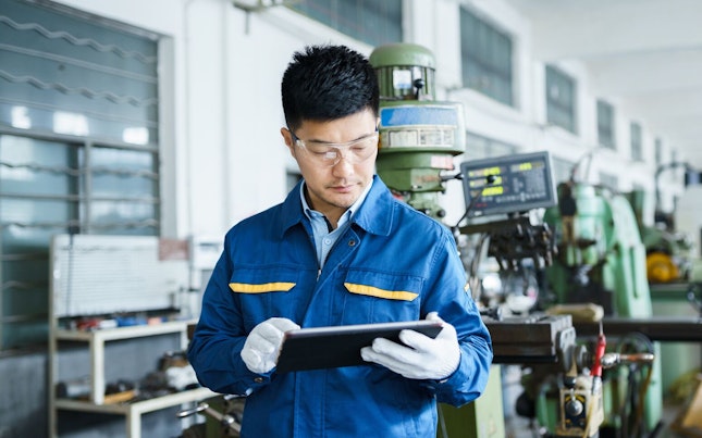 Industrial Engineer Working with a Tablet