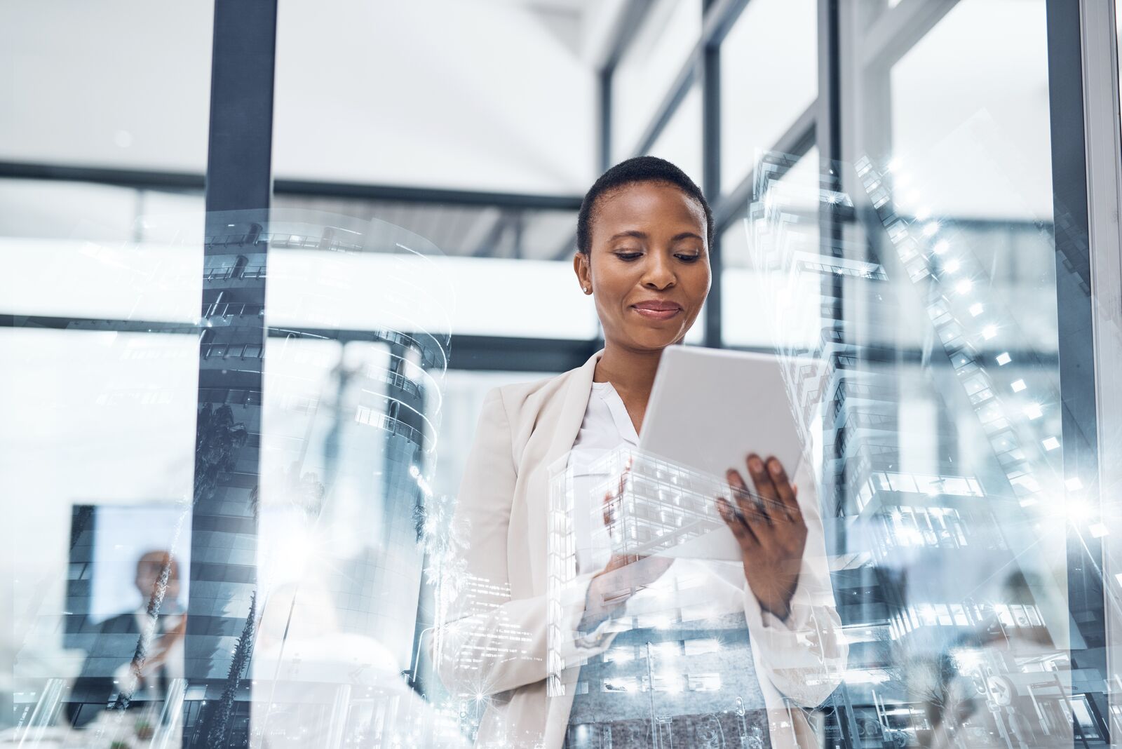 Lady Holding Tablet in Meeting Room in Front of Window