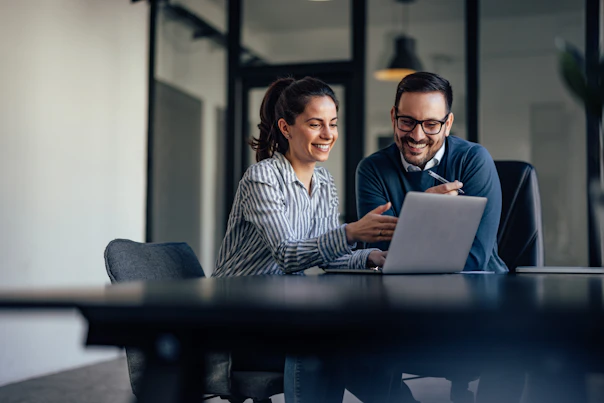 Portrait of Two Business Colleagues Looking at Something Online