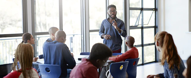 Professor Teaching Students in College Classroom