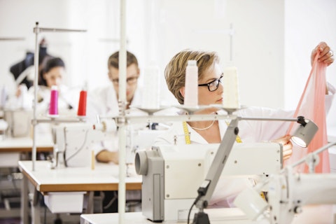 sewers at work in a textile factory Getty
