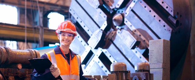 Smiling Worker in Steel Factory