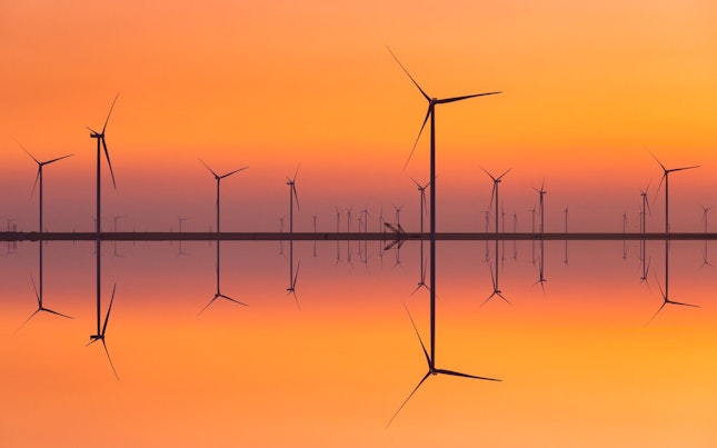 Wind Turbines on the Seashore at Sunset