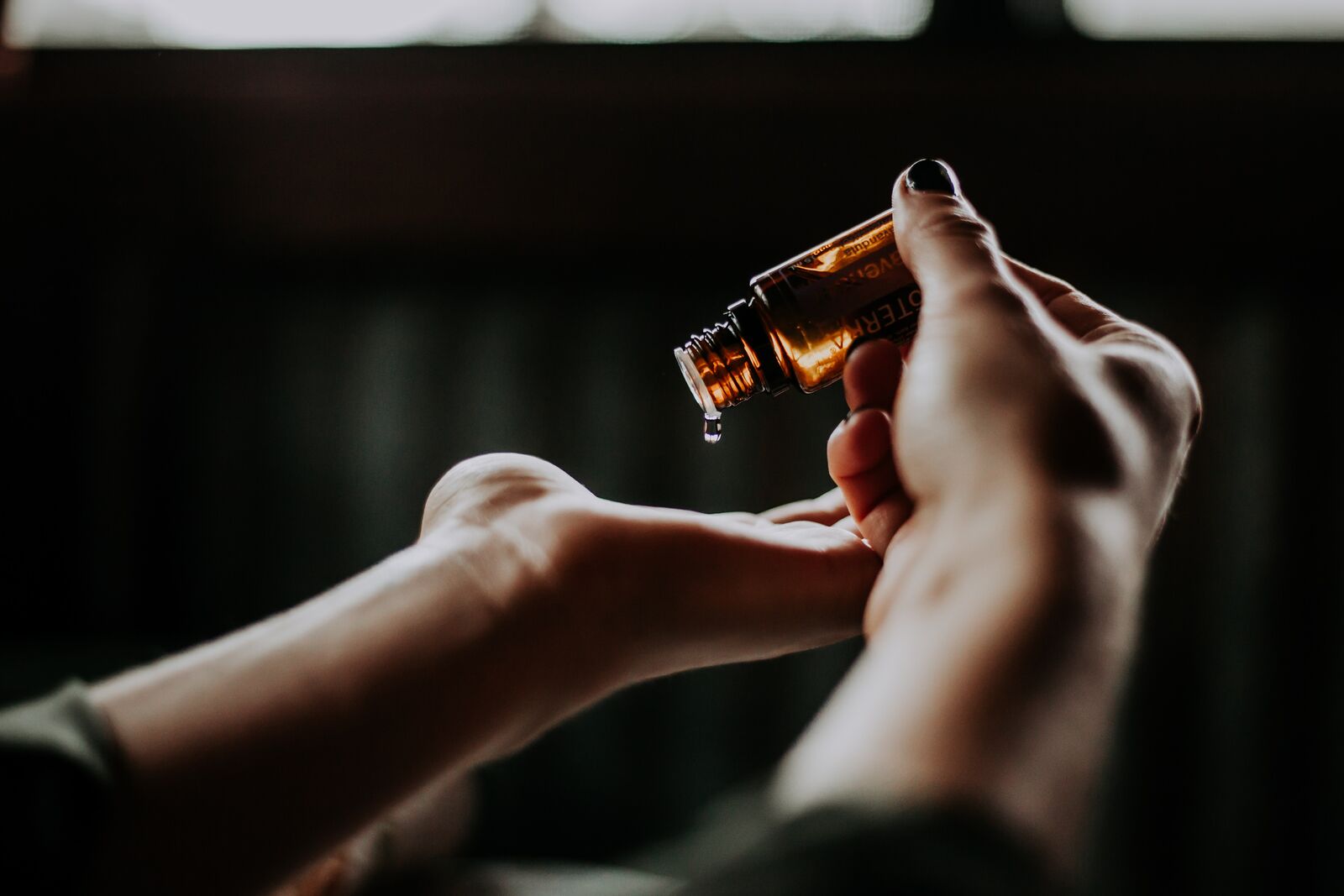 Woman Applying Essential Oil