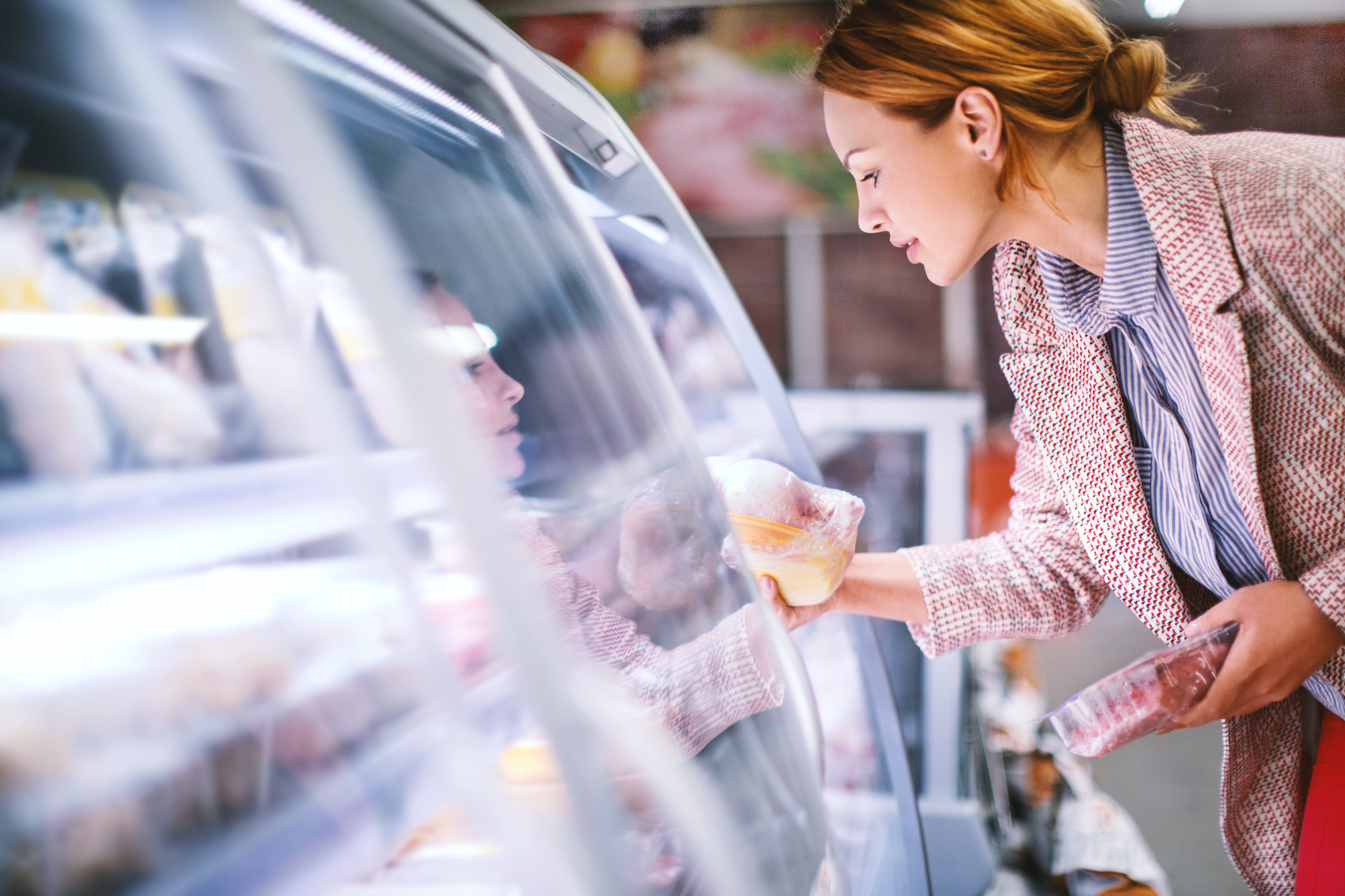 Woman Buying Food in a Supermarket