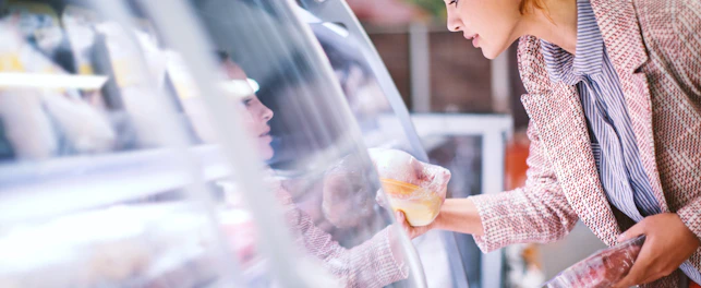 Woman Buying Food in a Supermarket