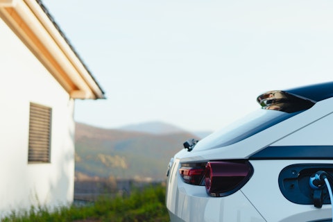 Woman Charging Her Car at Home