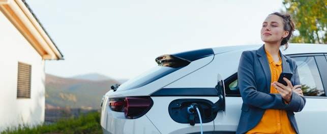 Woman Charging Her Car at Home