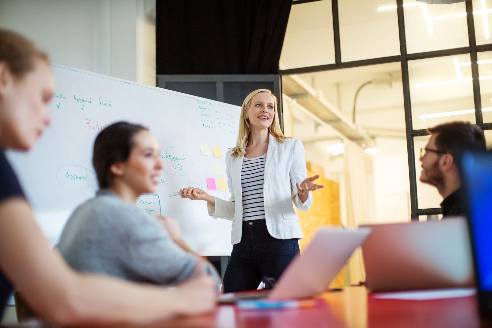 Woman Giving a Presentation in a Conference Room