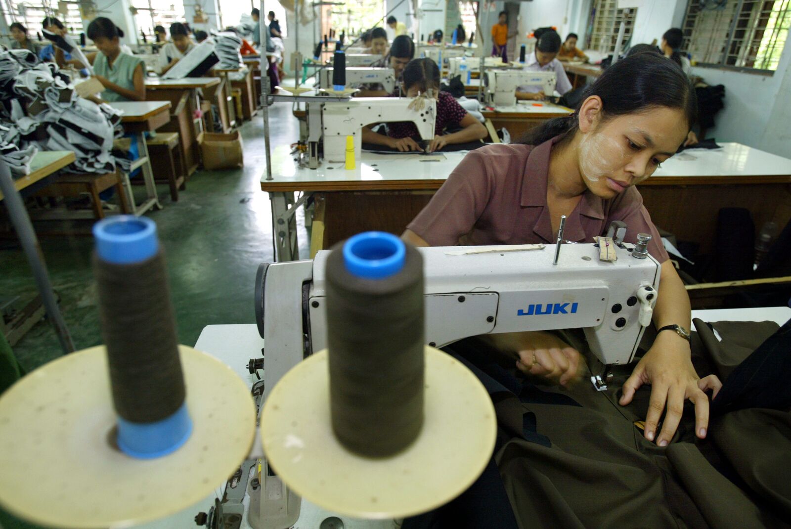 Woman Sewing in a Factory in Burma