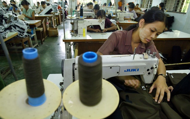 Woman Sewing in a Factory in Burma