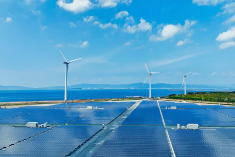 Aerial view of a hybrid wind and solar power plant