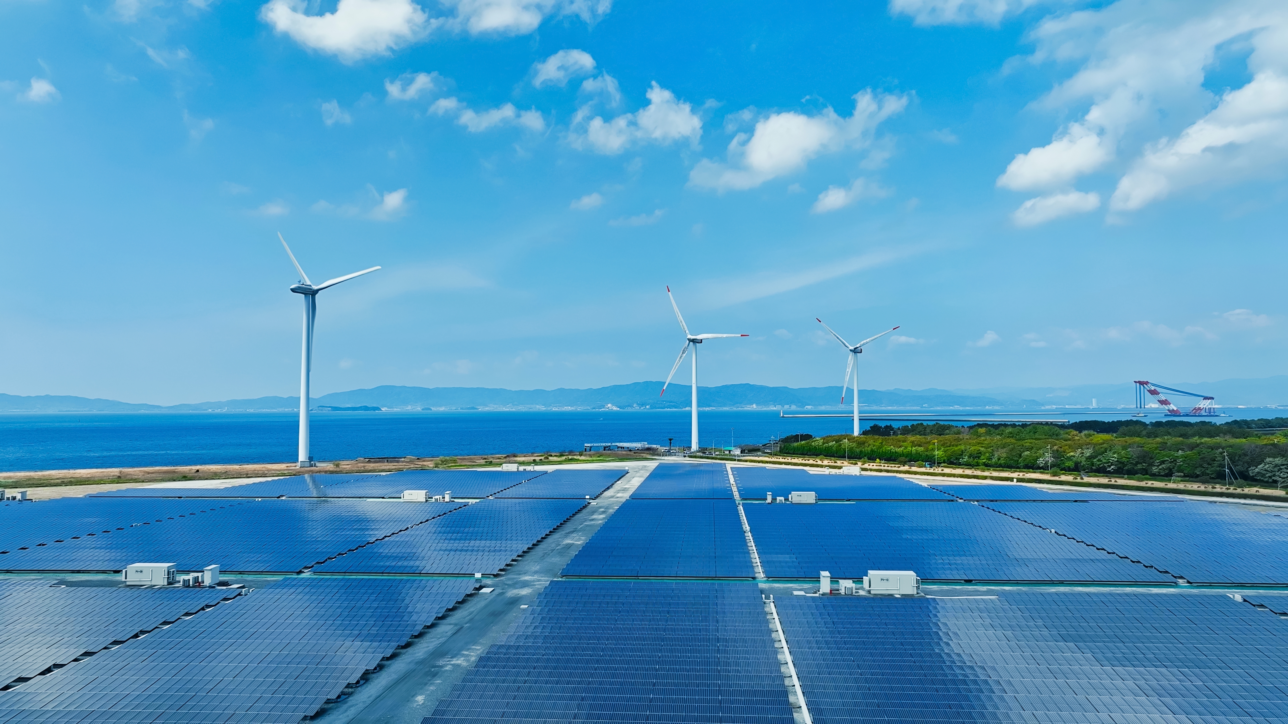 Aerial view of a hybrid wind and solar power plant