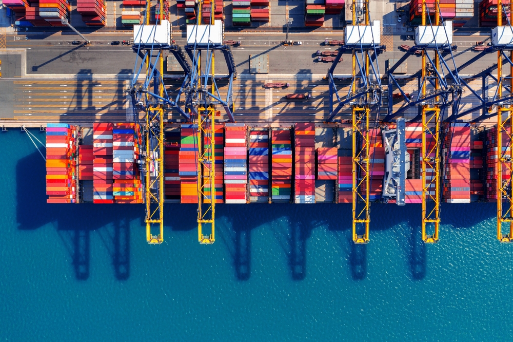 Aerial View of Cargo Ship and Cargo Container in Harbor