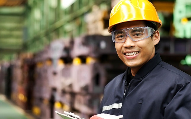 Auditor Carrying an Inspection at a Factory