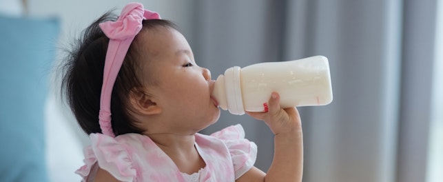 Baby Drinking Milk in a Bottle