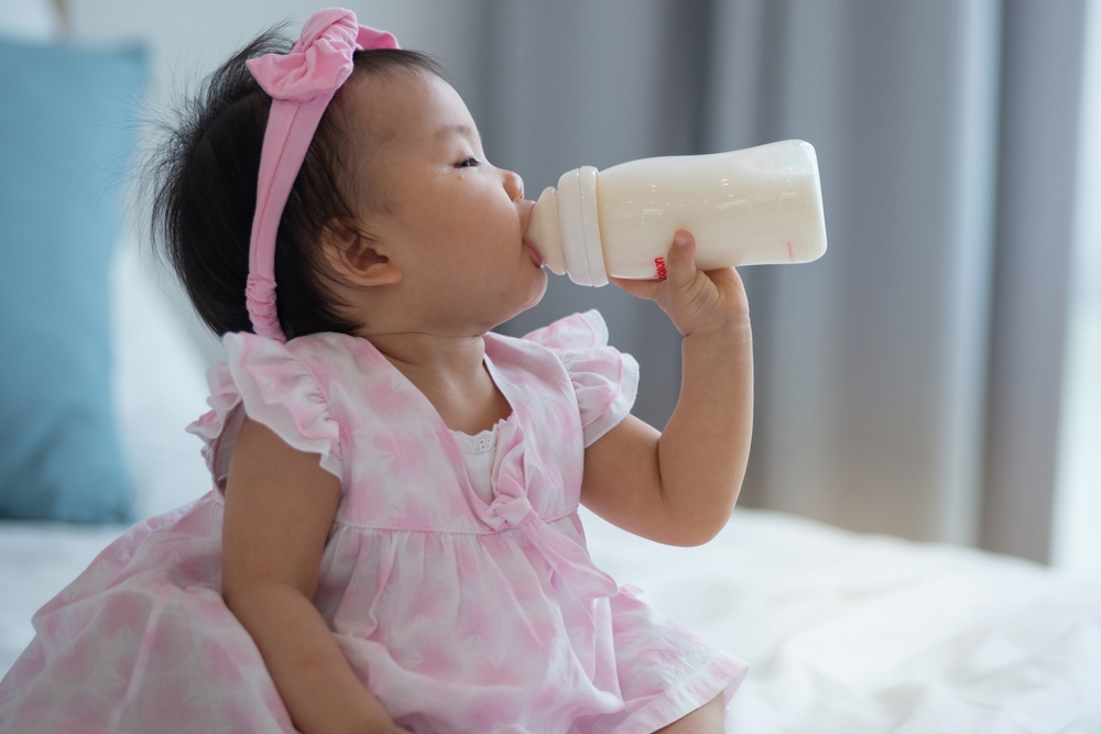 Baby Drinking Milk in a Bottle