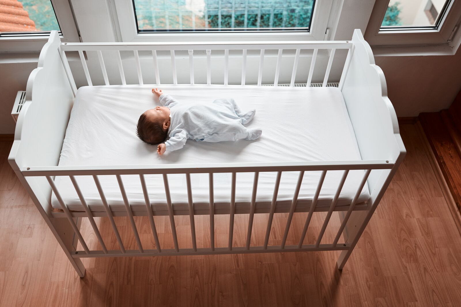 Baby Resting in a Crib