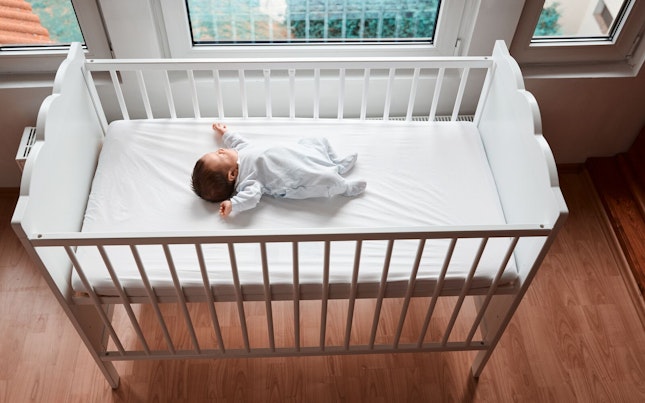 Baby Resting in a Crib