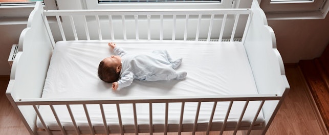 Baby Resting in a Crib