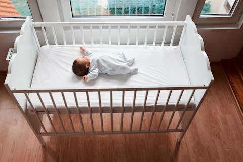 Baby Resting in a Crib