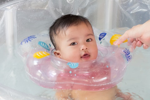 Baby Swimming with Neck Swim Ring in Swimming Pool