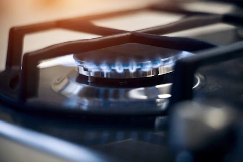 Blue flames on gas stove burner