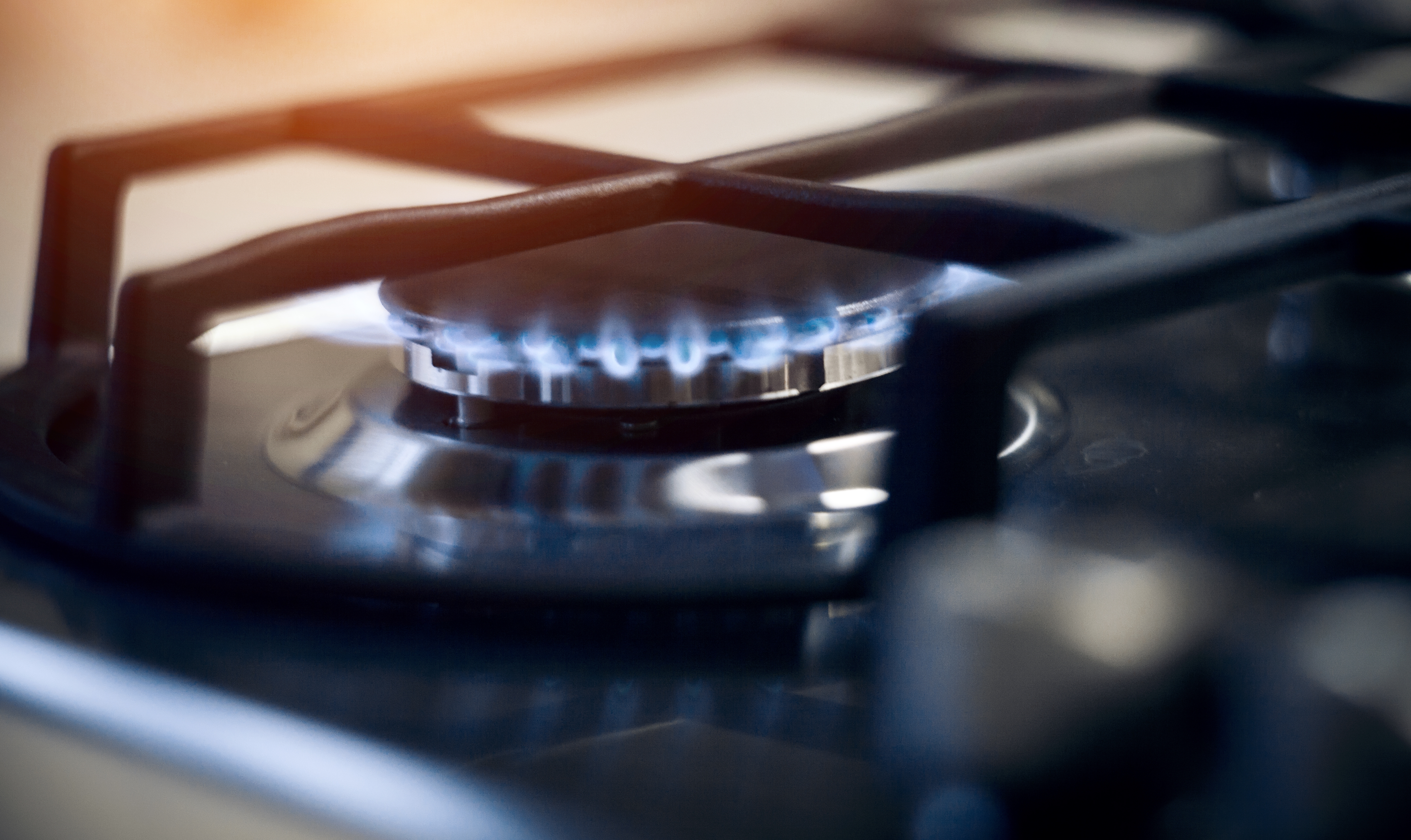 Blue flames on gas stove burner