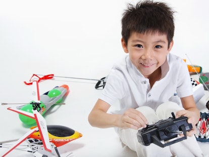 Boy Playing with Remote Control Toys